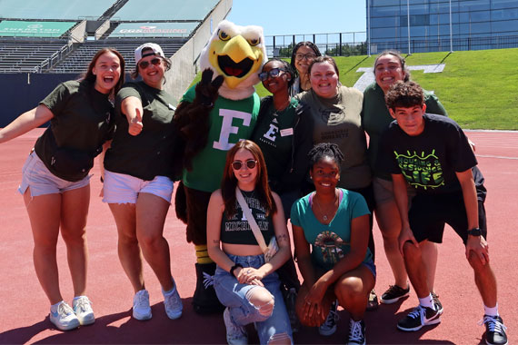 EMU students with Swoop mascot.