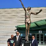 EMU President Dr. Jim Smith and Scott Wetherbee pose with former professional basketball player, George Gervin after the unveiling of a statue in his honor, located outside of the George Gervin GameAbove Center. Pictured left to right, President Jim Smith, George Gervin, and Scott Wetherbee, Vice President and Director of Intercollegiate Athletics. 