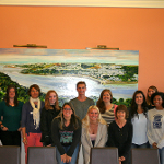 Students and Faculty with a painting of the port city of Brest