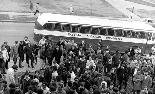 A black and white photograph of a group of protestors