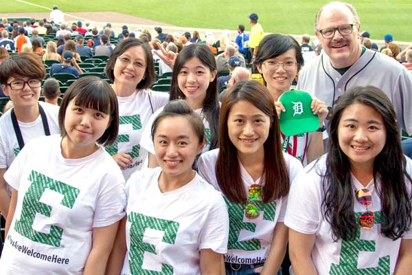 International students at a Detroit baseball game with the president.