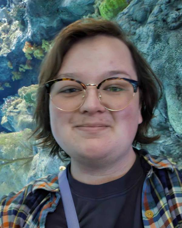 Smiling person with glasses