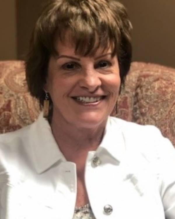 smiling person with short dark hair