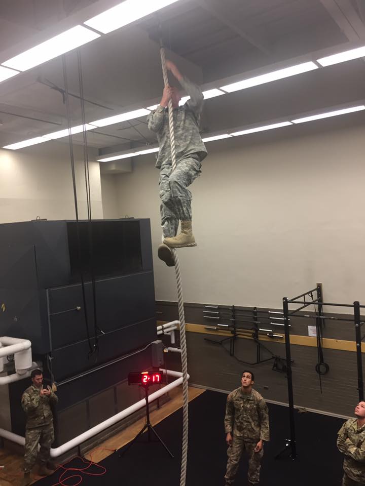Cadet climbing a rope in Roosevelt Hall Gym