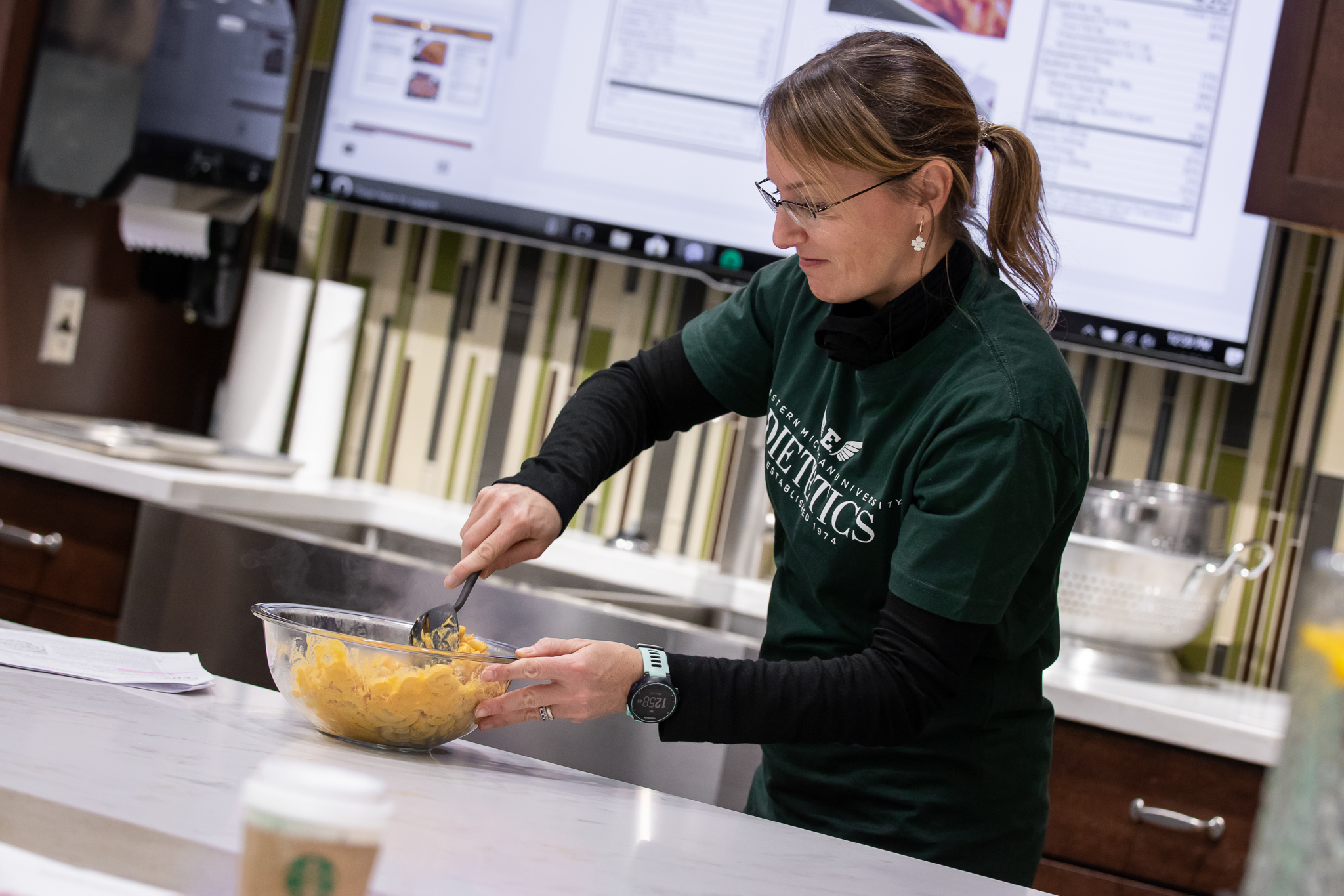 A dietetic student demonstrating a recipe.