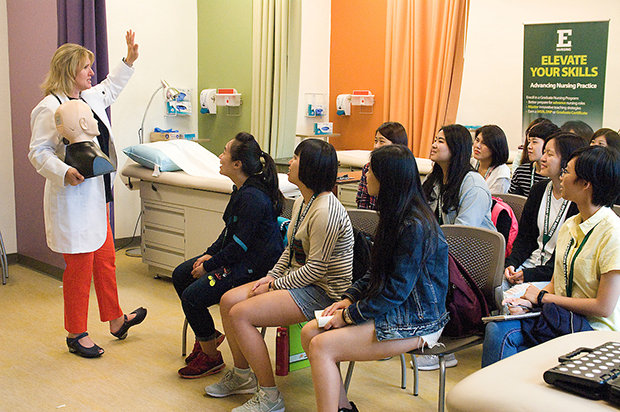 Image of a nurse teaching a group of people.