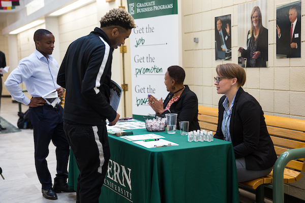 Students networking at a business event.