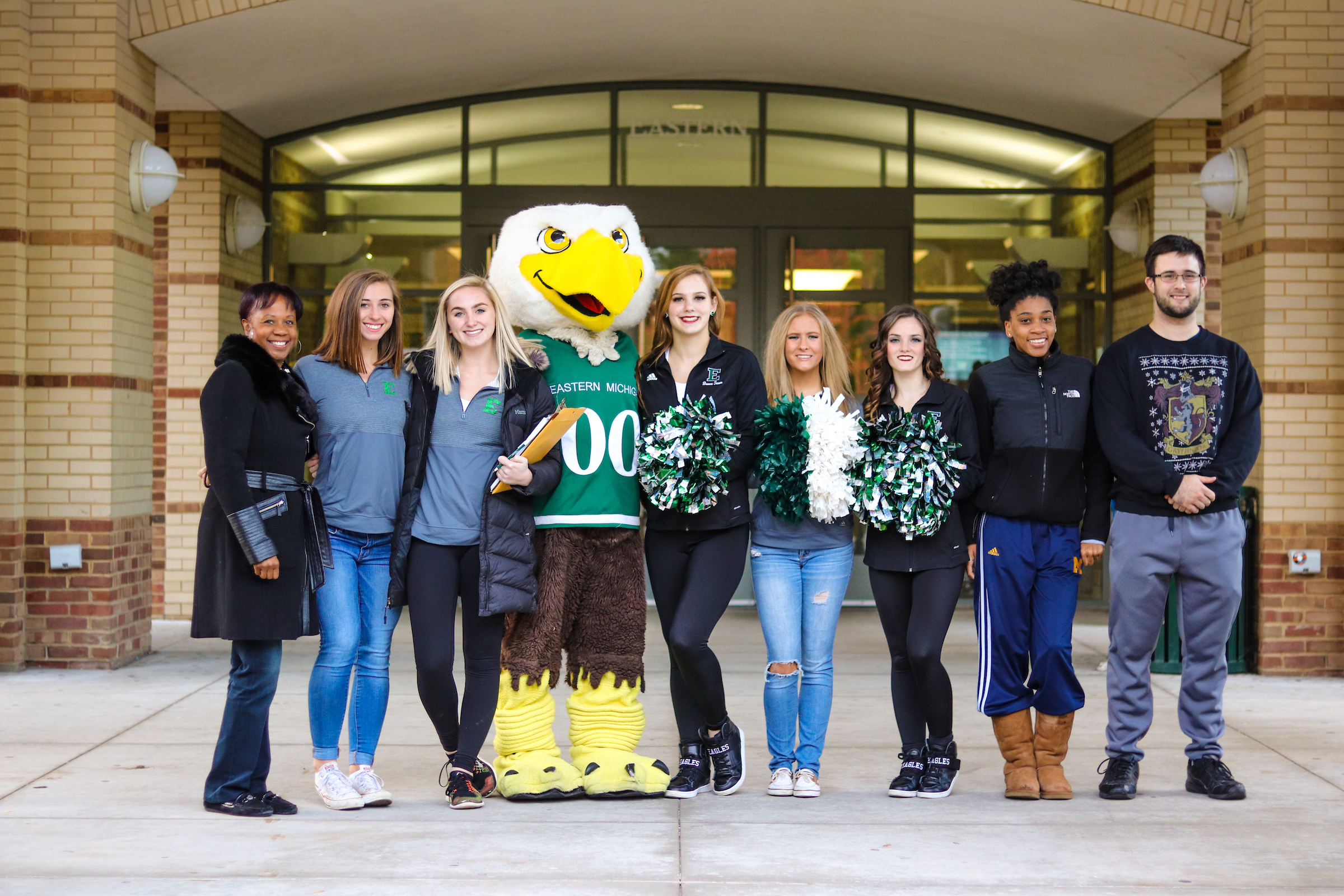 A photo of PR students standing with the EMU mascot, Swoop.