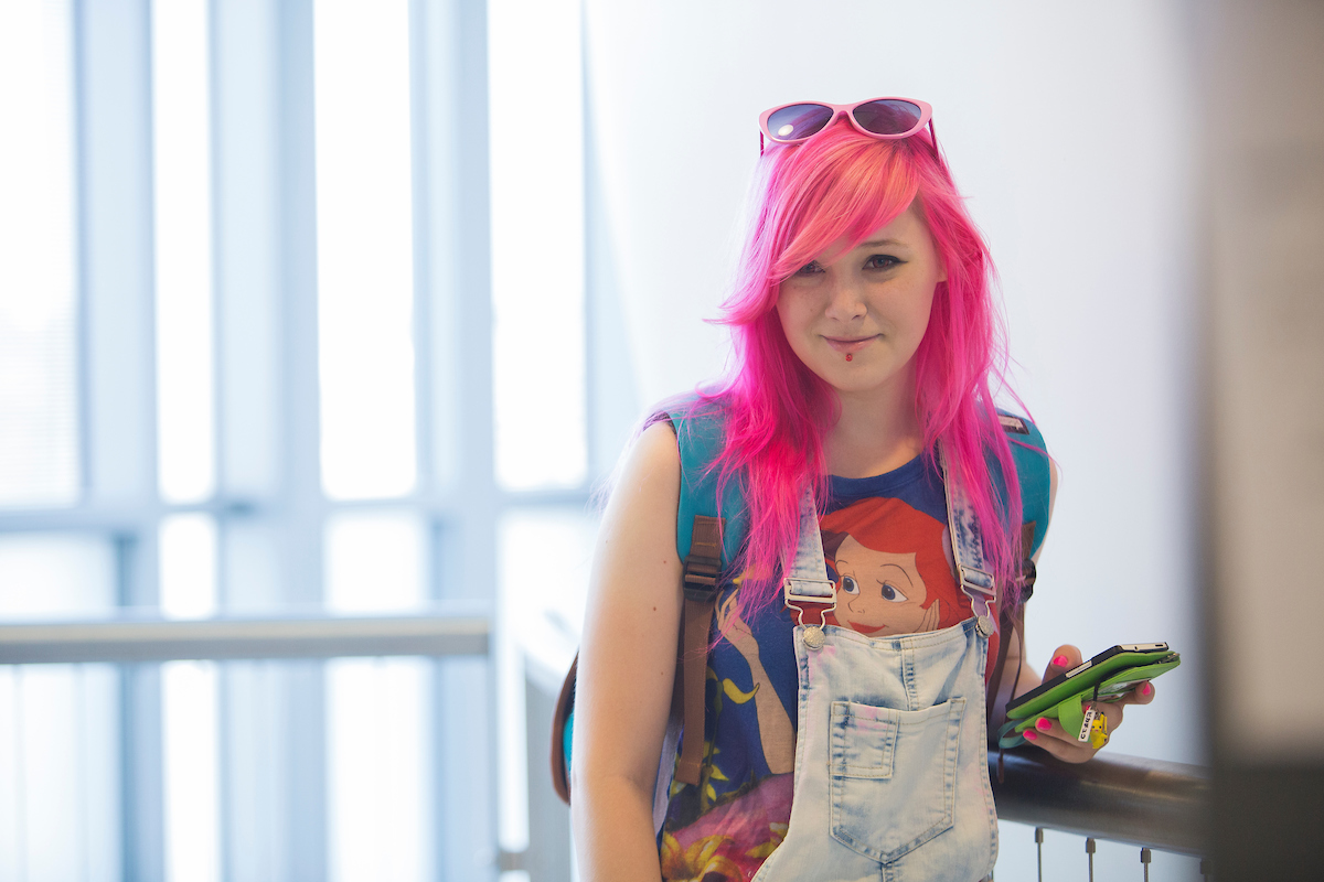 A female student with pink hair