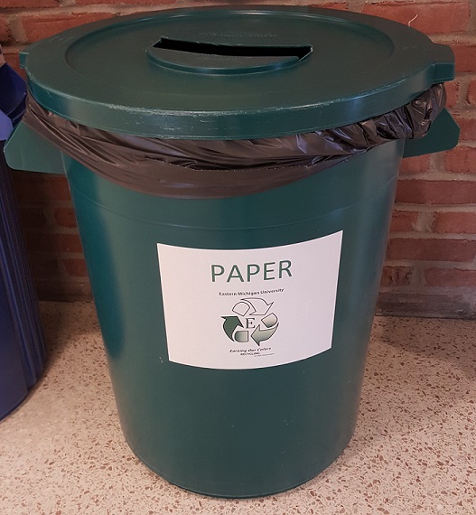 A photo of a paper recycling bin.