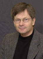 Image of Dr. Ronald Delph in a suitcoat and dark shirt