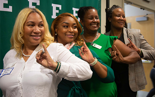 Alumni posing at the Black Alumni Mixer