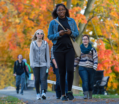 Students walking on campus in autumn
