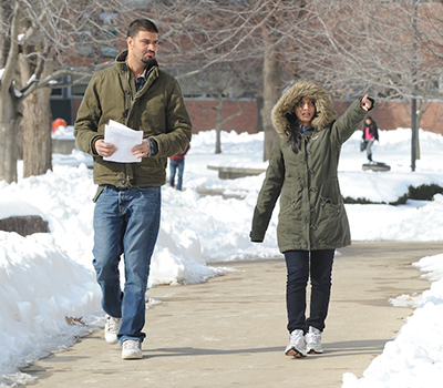 Students walking on campus in winter