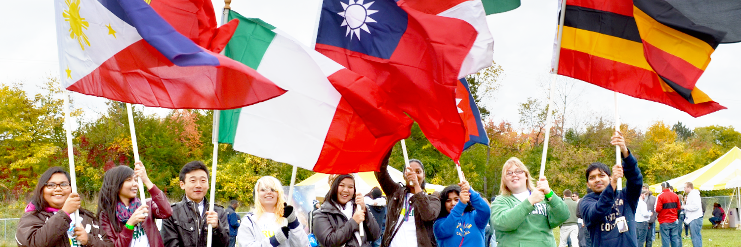 students holding country flags