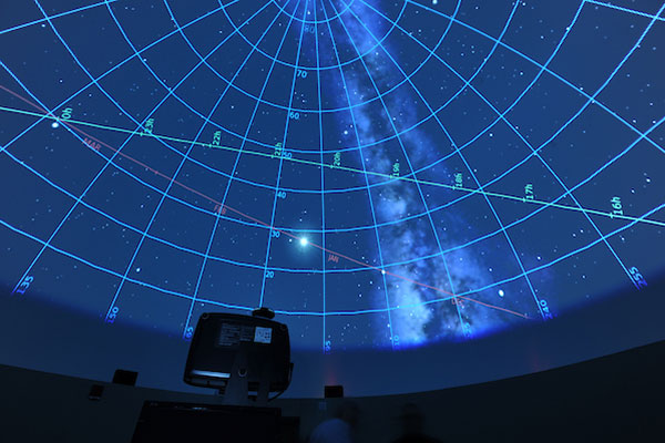 A photo of the night sky projected on to the EMU Planetarium's dome ceiling.
