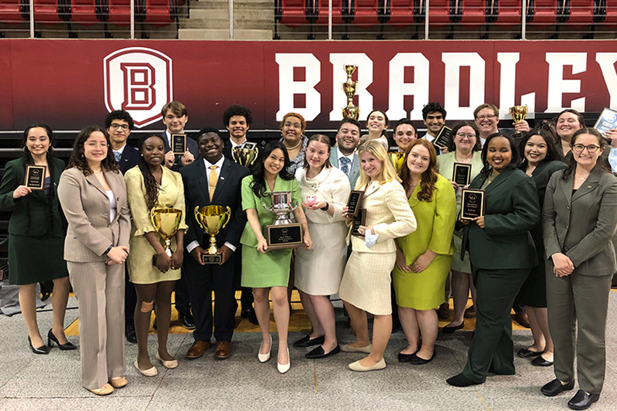 Forensics team with trophies